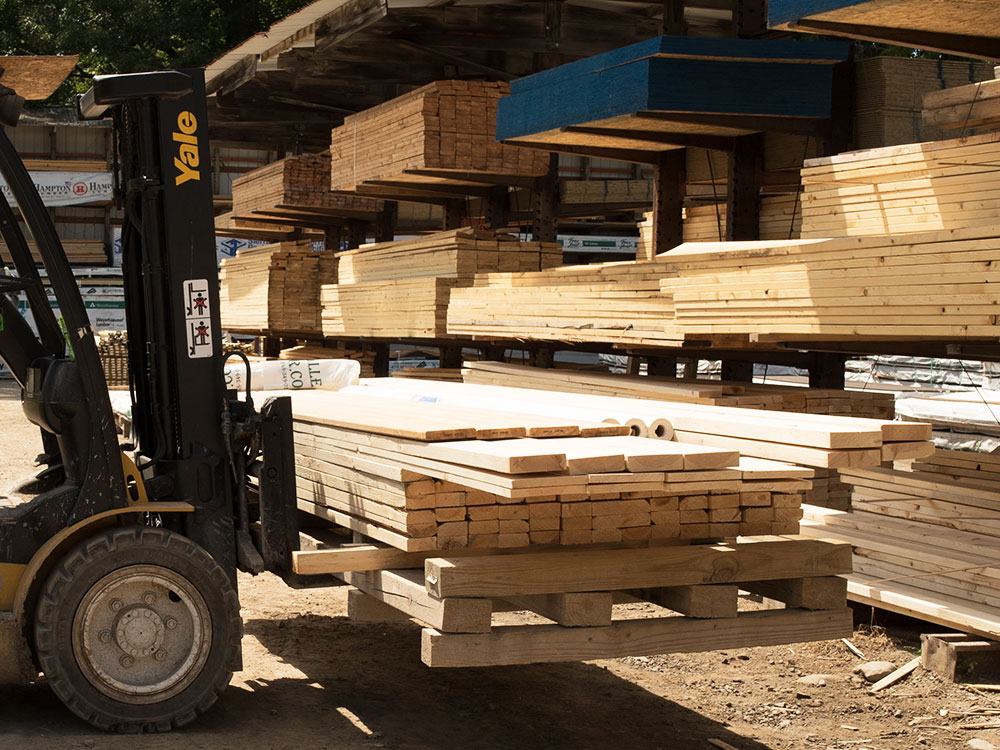 Hi-Lo moving stacks of Lumber at our Northville Lumber yard